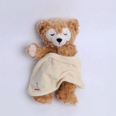 A duffy bear cuddle doll accompanies the sleep