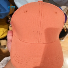peaked cap orange average size